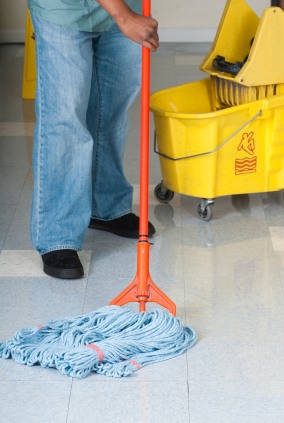 Delcon Maintenance Corp janitor in Rocky Hill, CT mopping floor.